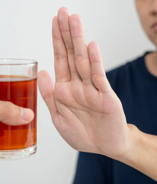 lost angels alcohol detox man holding glass tea