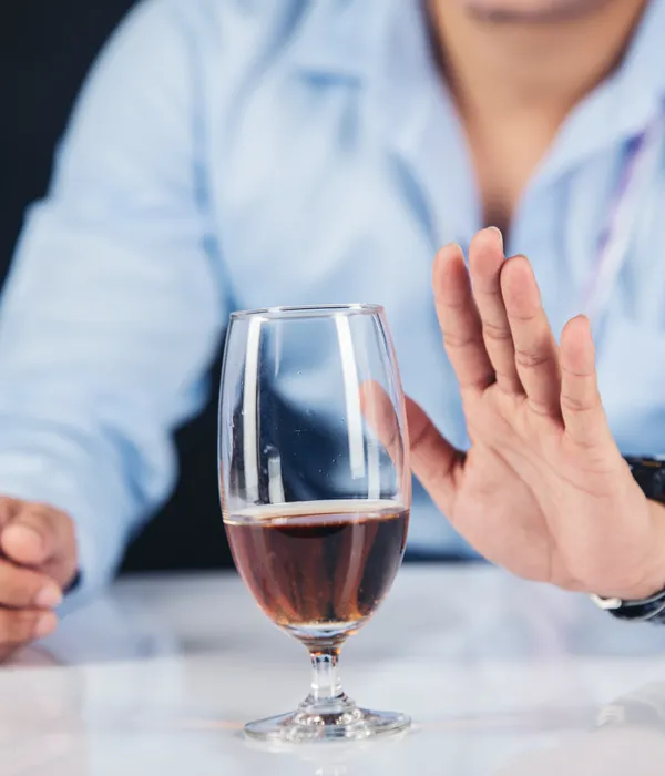 lost angels alcohol detox man sitting table glass wine