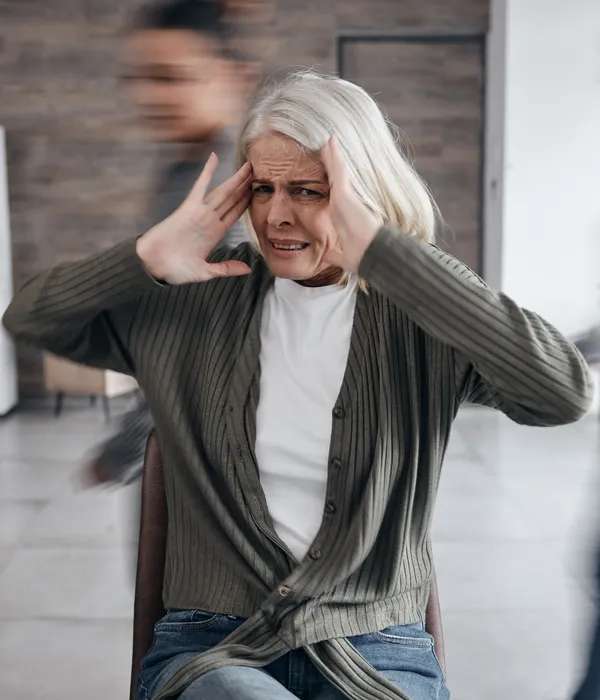 lost angels alcohol detox woman sitting chair hands head