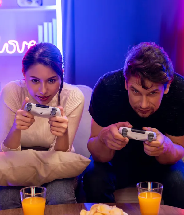 lost angels gaming addiction man woman sitting couch playing video