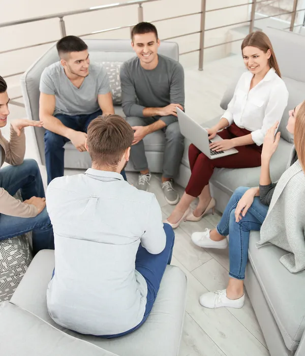 lost angels group therapy people sitting couchs circle