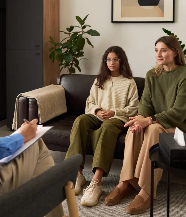 lost angels group therapy two women sitting couch talking each