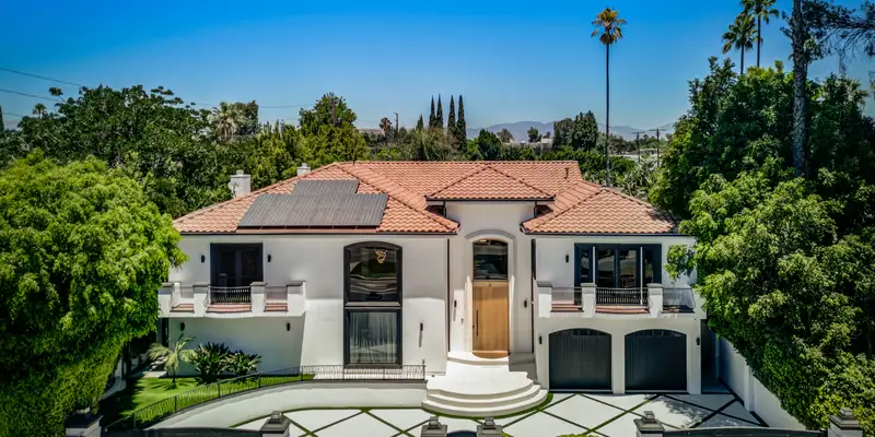 lost angels house red roof white surrounded trees