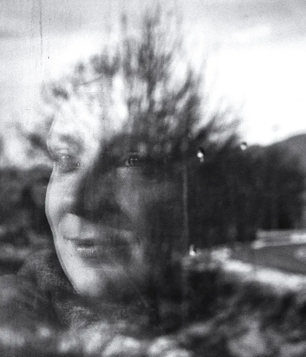 lost angels mental health woman looking out window camera