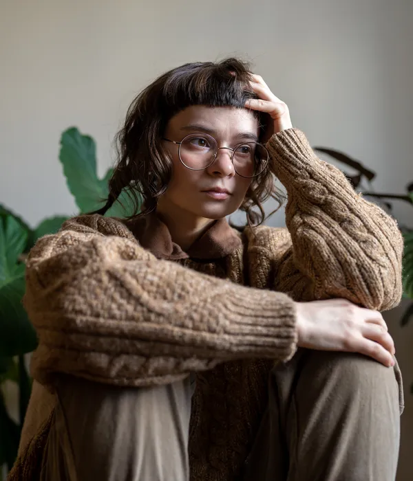 lost angels mental health woman wearing glasses sweater