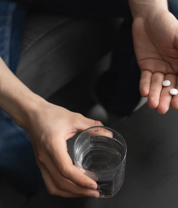 lost angels opioid person holding glass water
