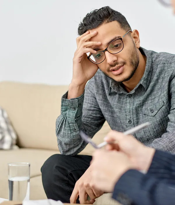 lost angels therapy man sitting couch hand head