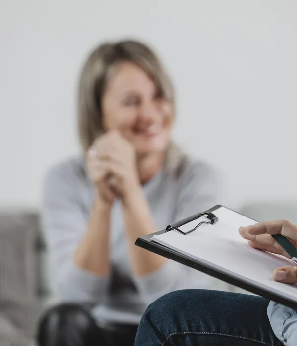 lost angels therapy woman sitting couch hand chin man behind