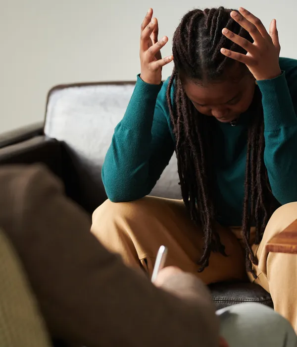 lost angels therapy woman sitting couch head hands